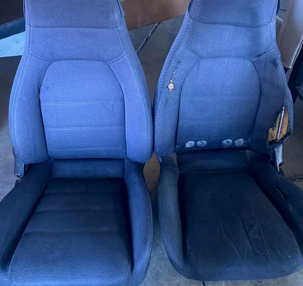 Cloth bucket seats before reupholstery.
