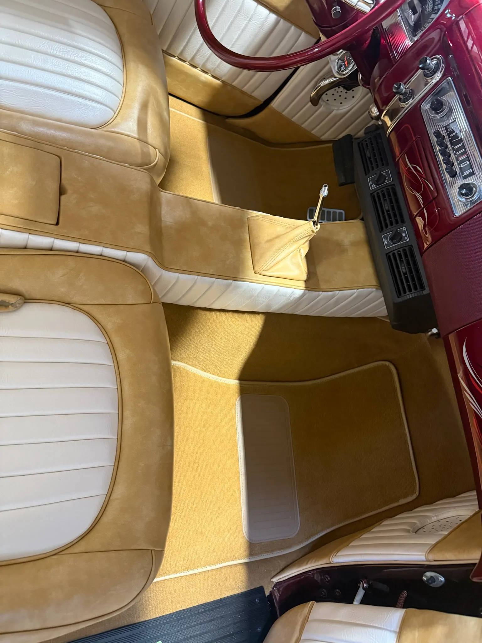 Top view of Buick Eight interior showing carpet and center console.