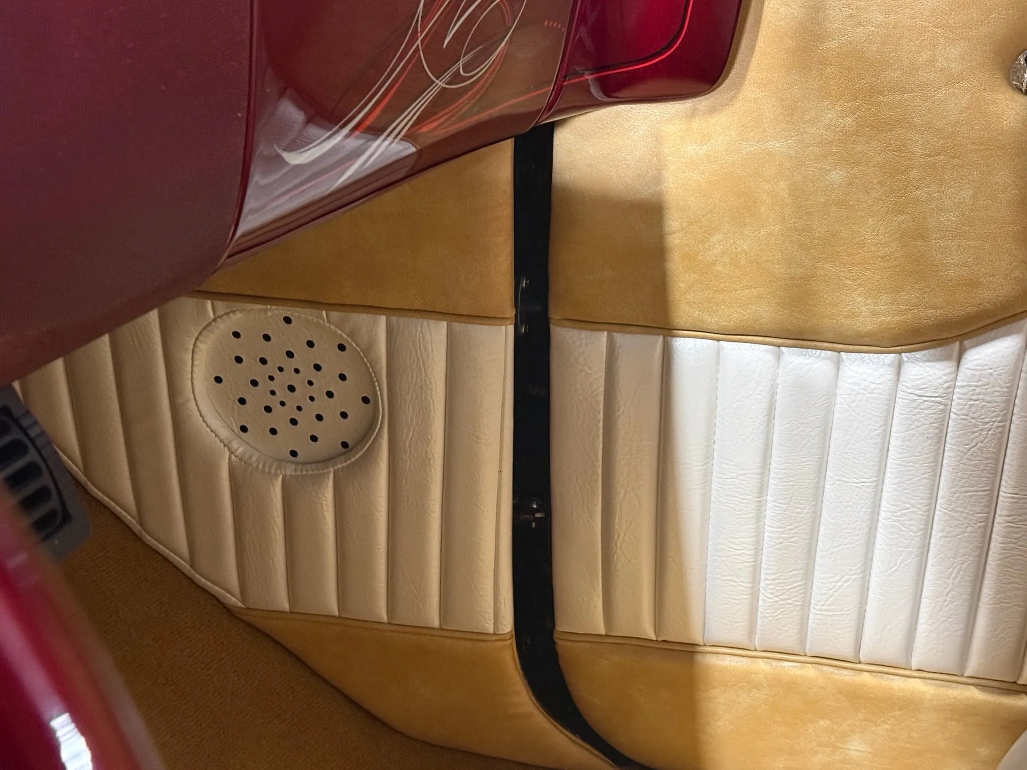 Custom Buick Eight door panel with white pleats and tan trim.