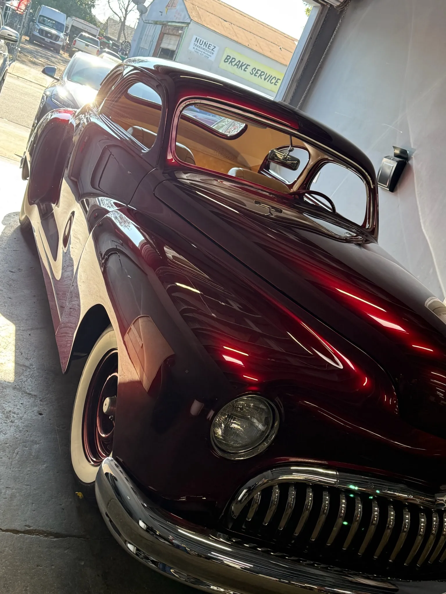 Front quarter view of classic Buick Eight with whitewall tires.
