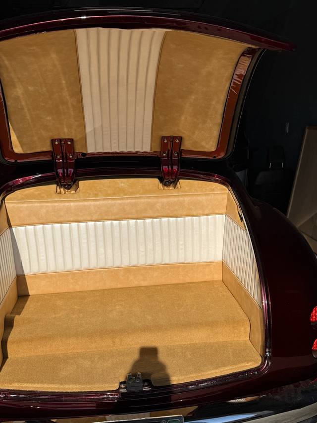 Upholstered Buick Eight trunk with tan and white custom panels.