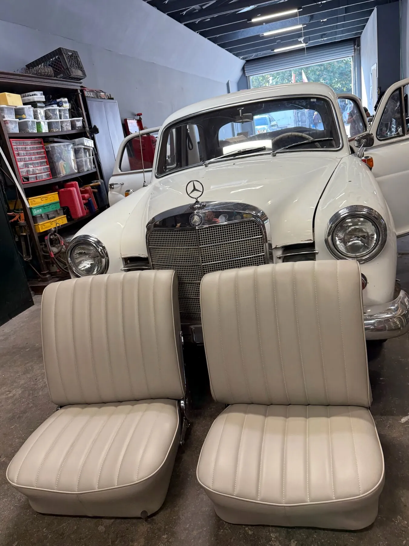Classic front seats with fresh upholstery in the shop.