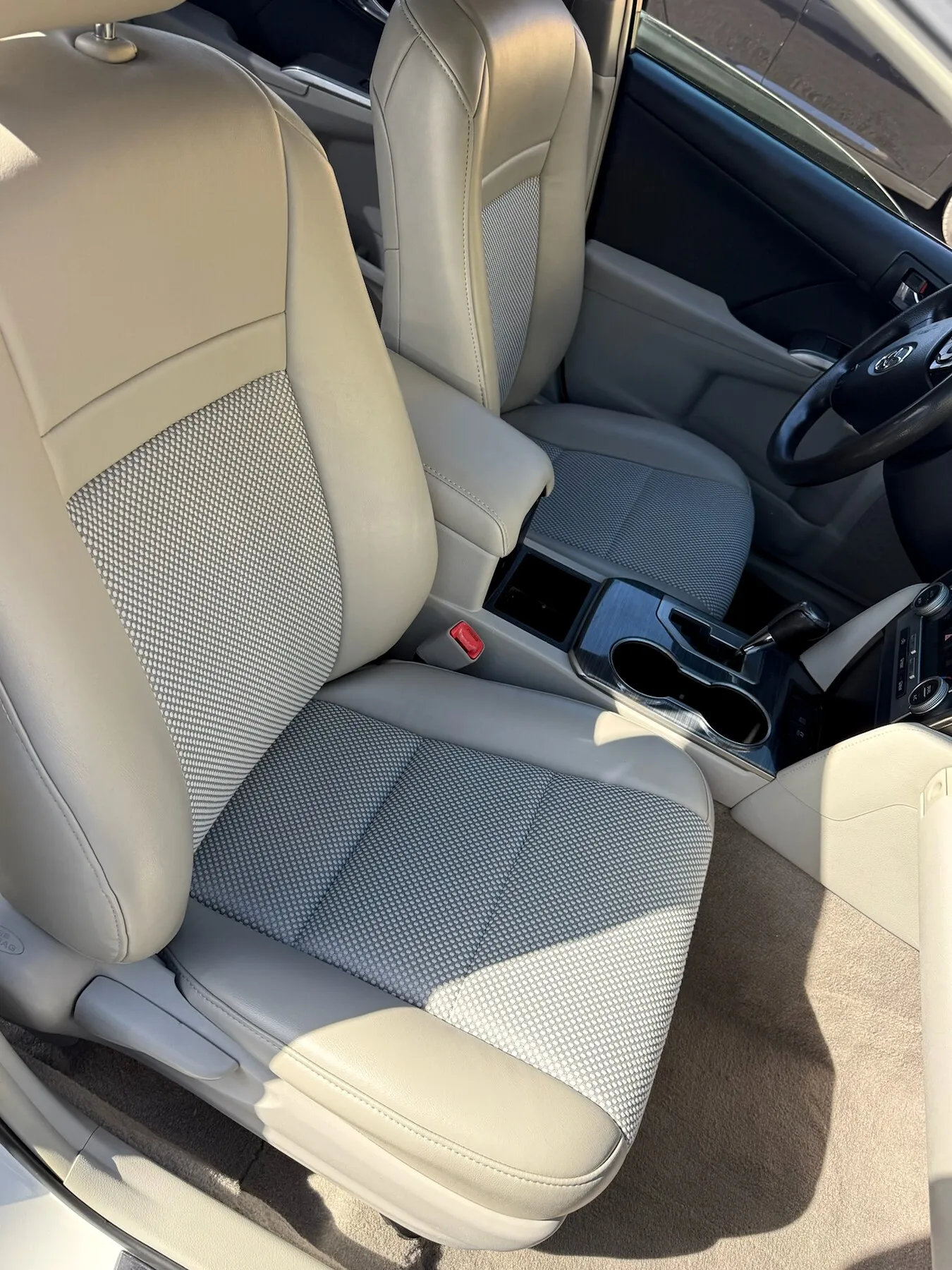 Classic red bench seat fabric and stitching detail.