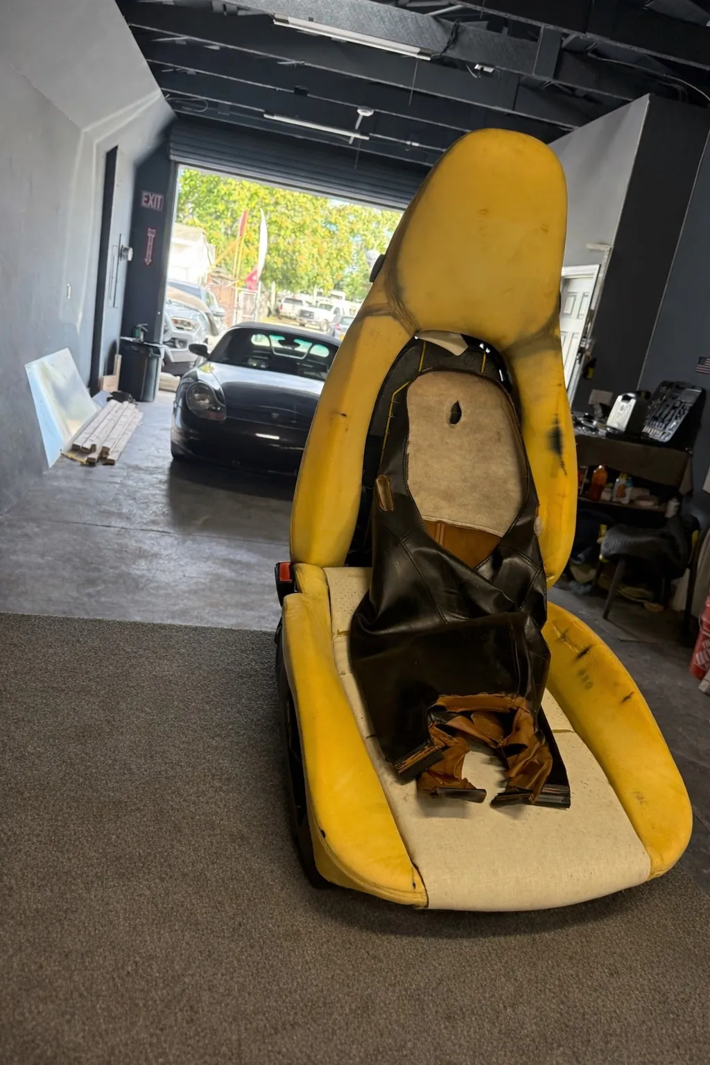 Porsche Boxster S seat core on the workbench during upholstery prep.