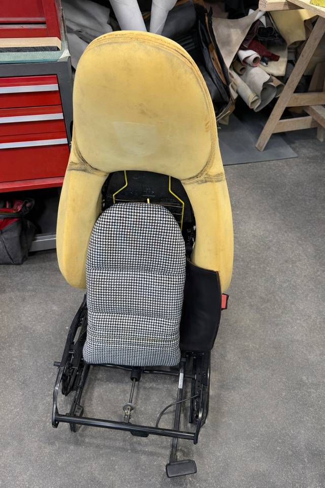 Porsche Boxster S seat disassembly showing original materials before reupholstery.