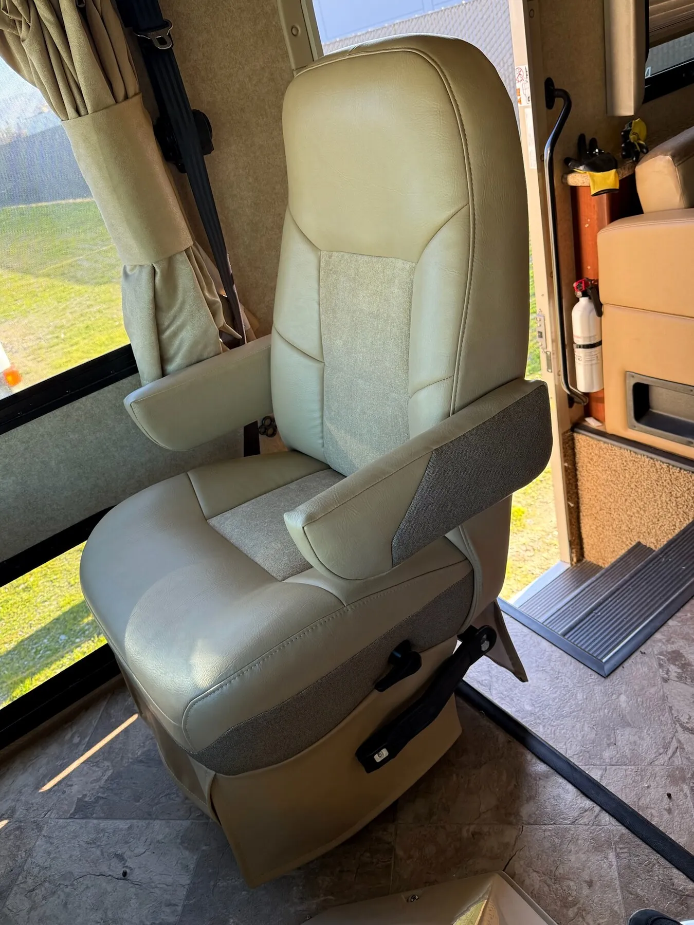 RV captain seat with fresh upholstery installed.