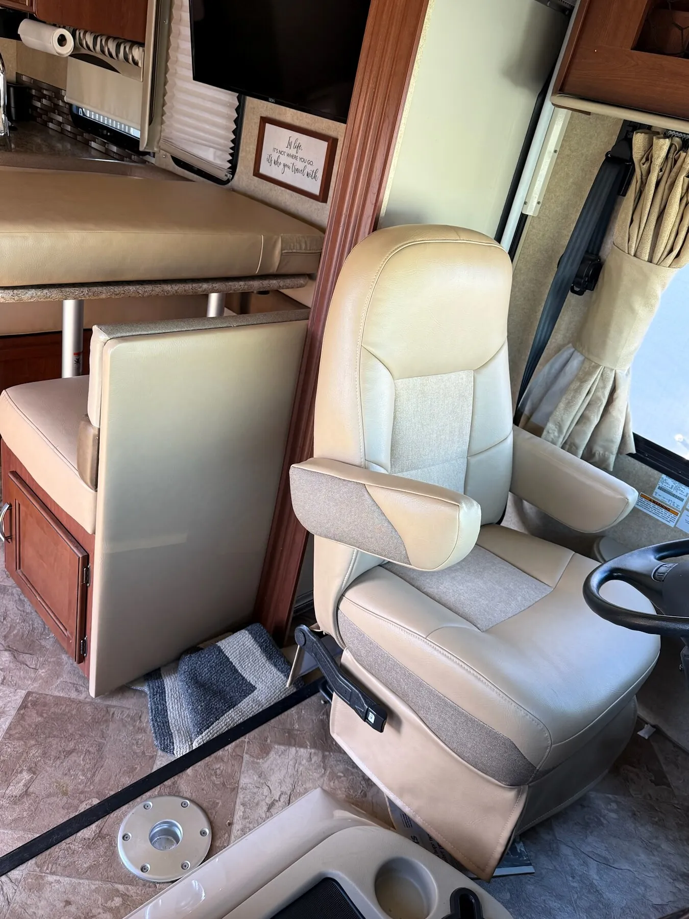 RV cockpit seat upholstery with matching materials.