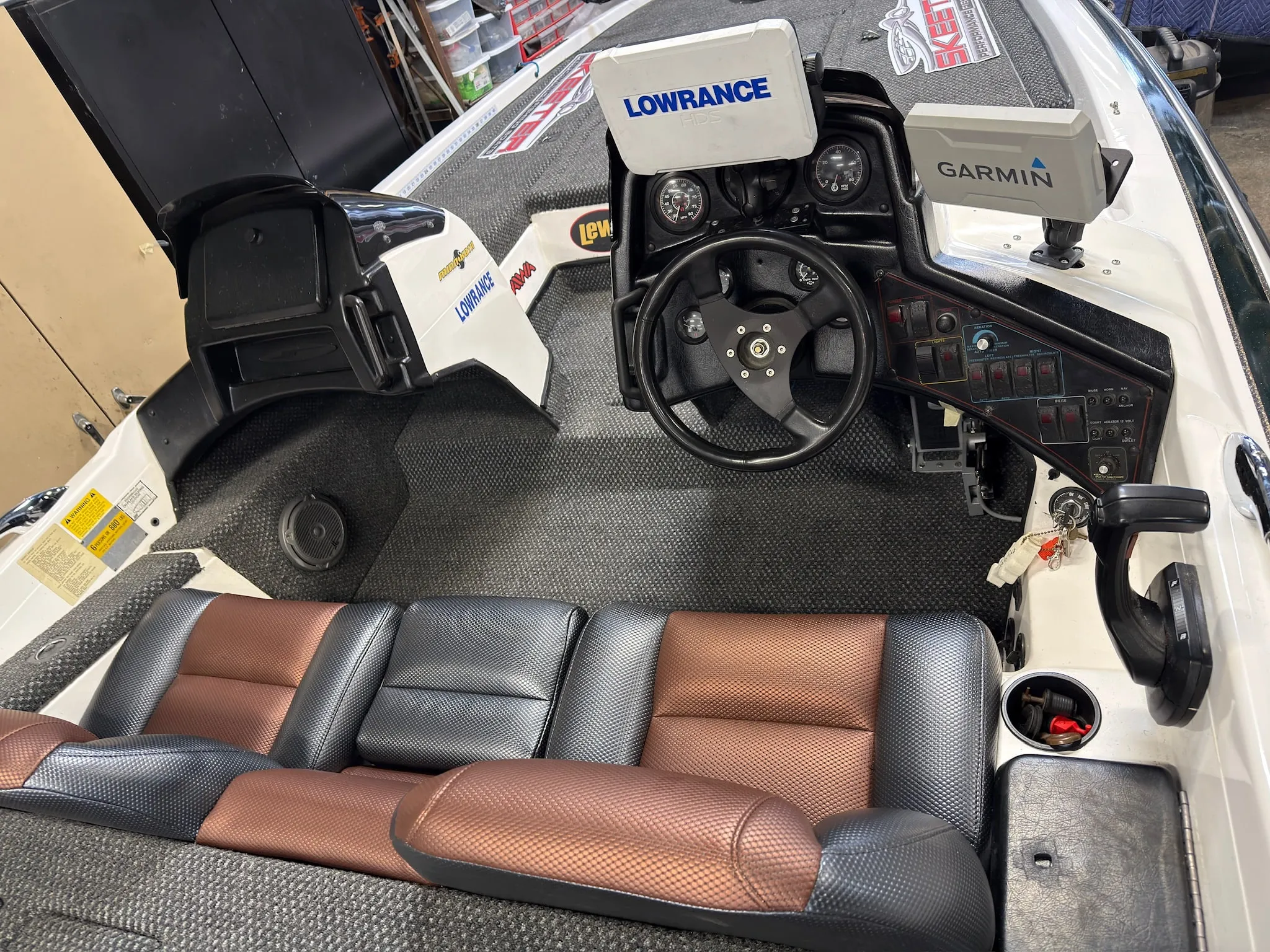 Cockpit and console area with new carpet and shop-built seating installed.