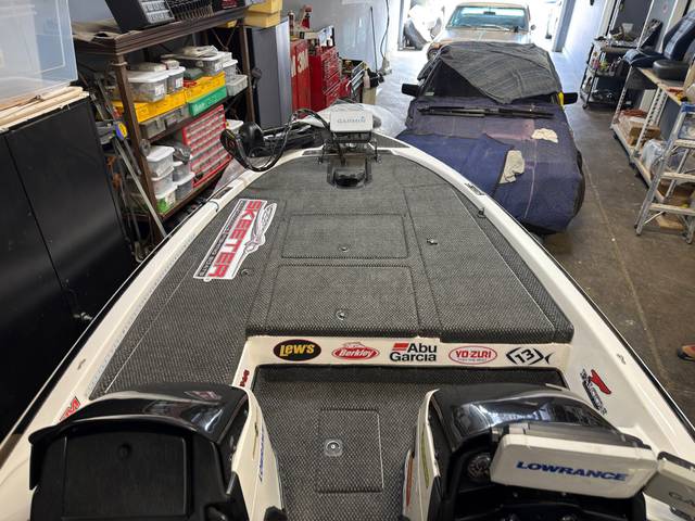 Front deck marine carpet fitted around hatch panels.