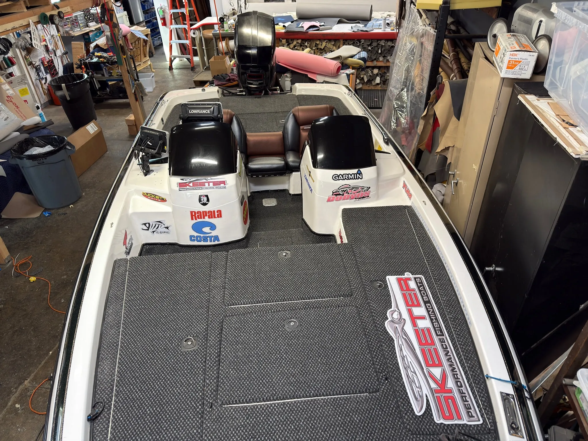 Rear deck carpet with shop-built reupholstered seating layout.