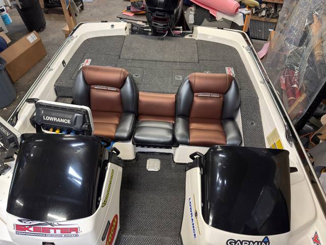 Finished cockpit with shop-built reupholstered seats, shaped foam support, and new marine carpet.