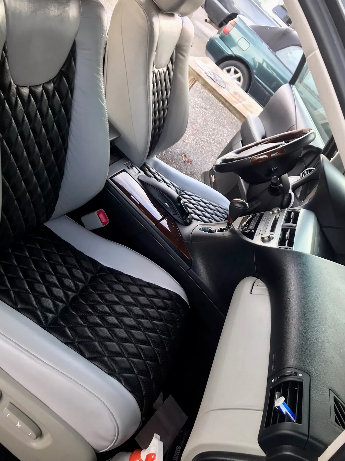 SUV interior with diamond-stitched seat upholstery.